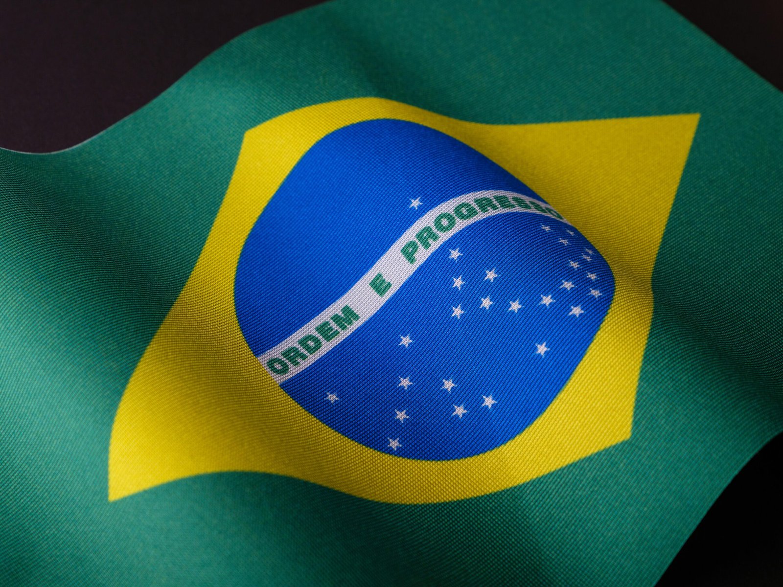 Detailed image of the Brazilian flag showcasing vibrant colors and emblem.